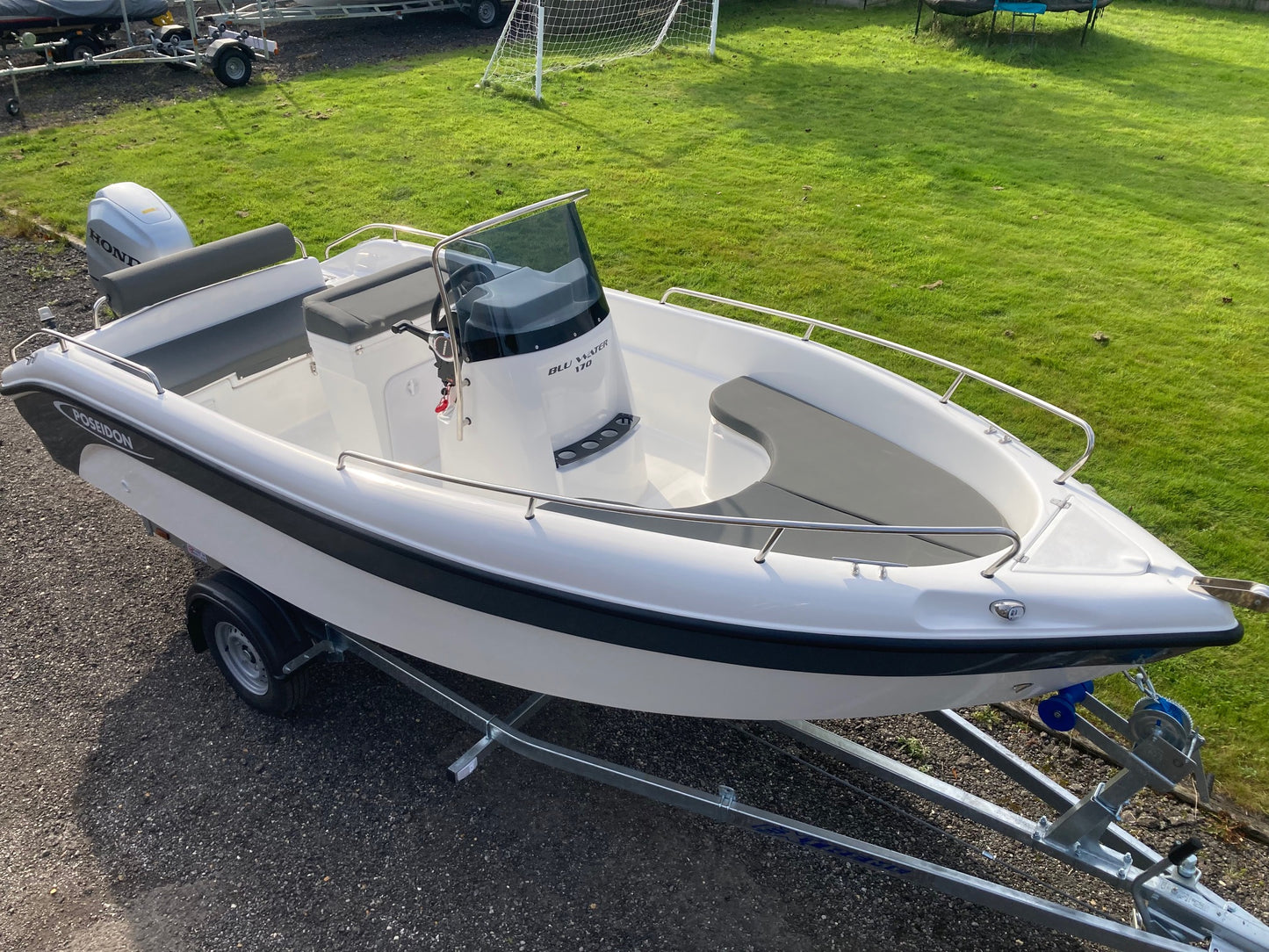 Poseidon Blu Water 170 + Honda Outboard + Road Trailer